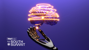 Ilustração futurista em fundo roxo mostrando uma mão robótica aberta, voltada para cima, sustentando um cérebro humano. Ao redor do cérebro, há anéis luminosos em tons de laranja e amarelo, sugerindo tecnologia, energia e conexão. No canto inferior esquerdo, aparece o texto “Workhub no South Summit”, indicando contexto de evento e inovação ligada à inteligência artificial e ao futuro do trabalho.